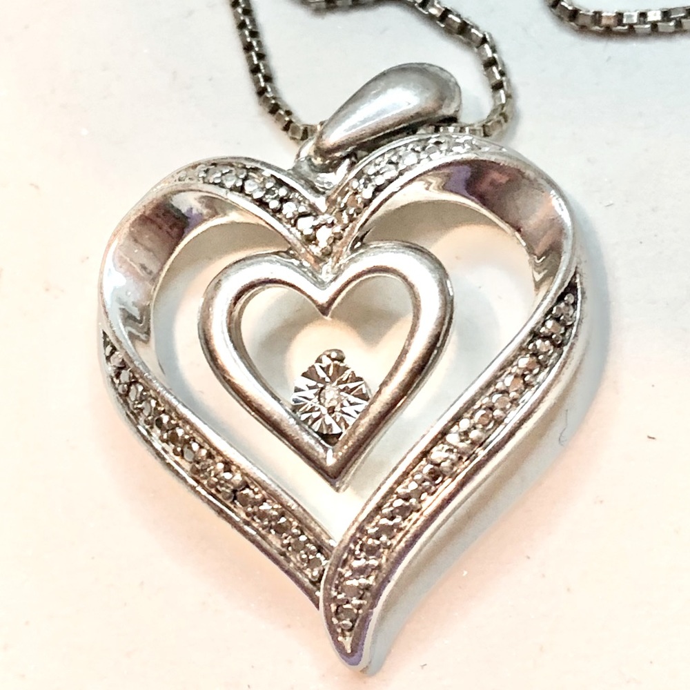 Beautiful Vintage stamped heart pendant and necklace.